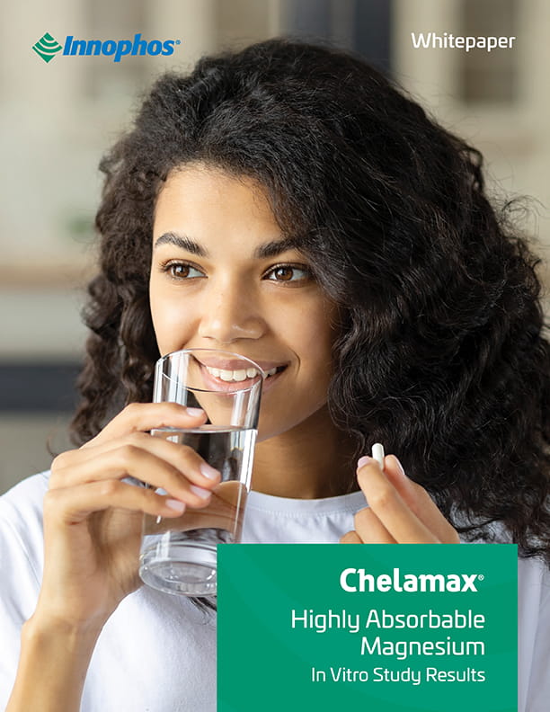 Woman drinking a glass of water before taking a pill