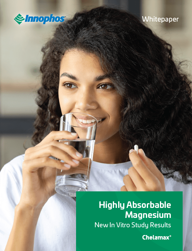 Woman drinking a glass of water before taking a pill