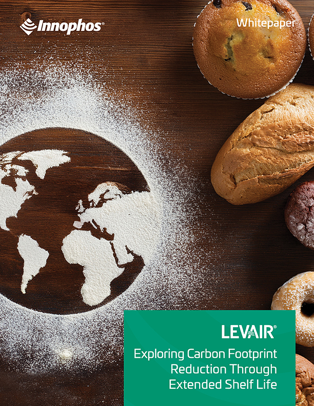 Bread and Earth-shaped flour on a wood surface