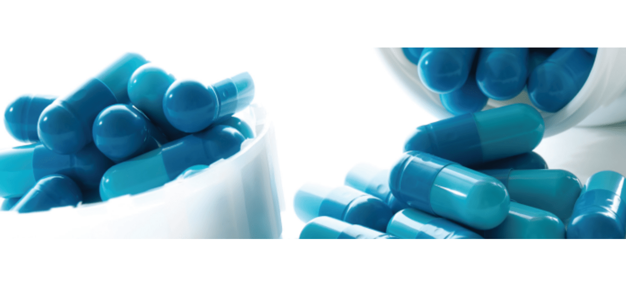 Blue capsules in white containers