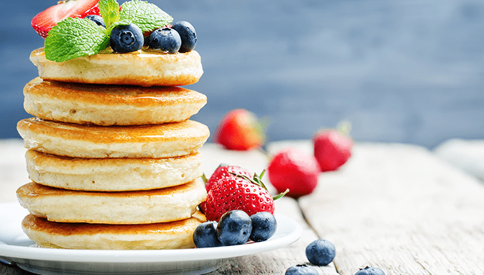 Stack of pancakes with berries on top