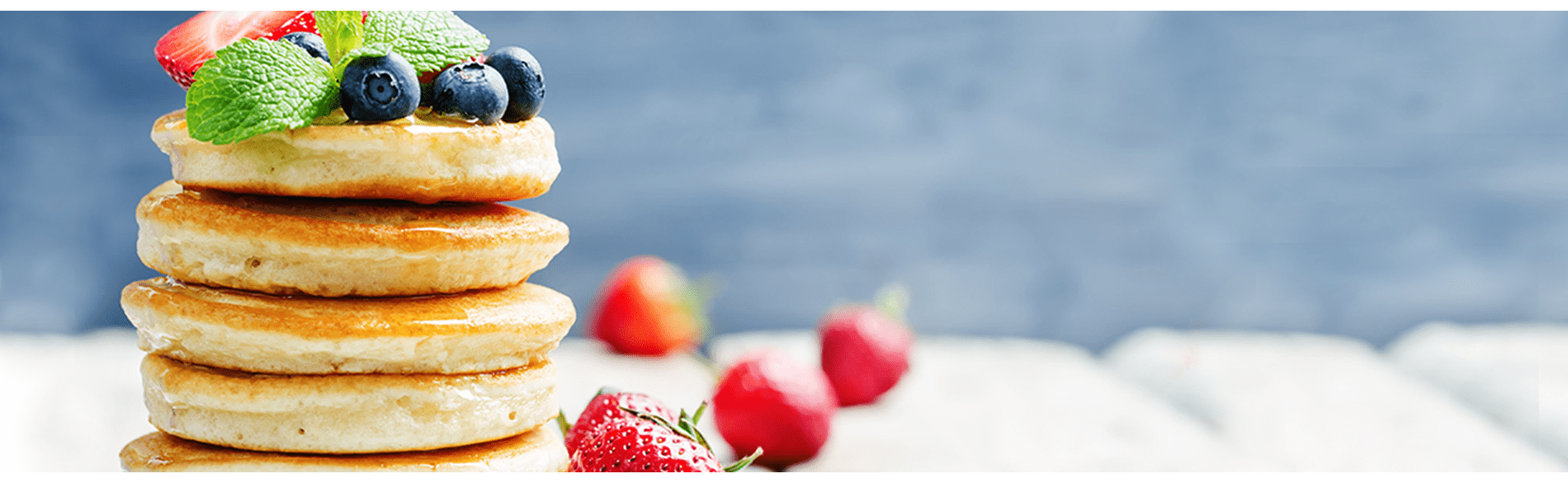 Stack of pancakes with berries on top