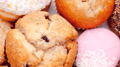 **Alt text:** Muffins with chocolate chips and donuts with colorful icing and sprinkles.