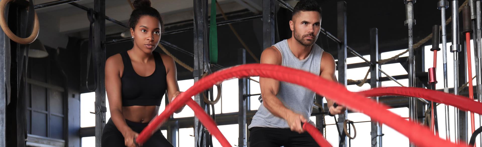Sports Nutrition - Couple doing Cross Fit Exercises