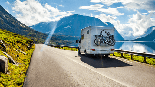Camper driving on asphalt road