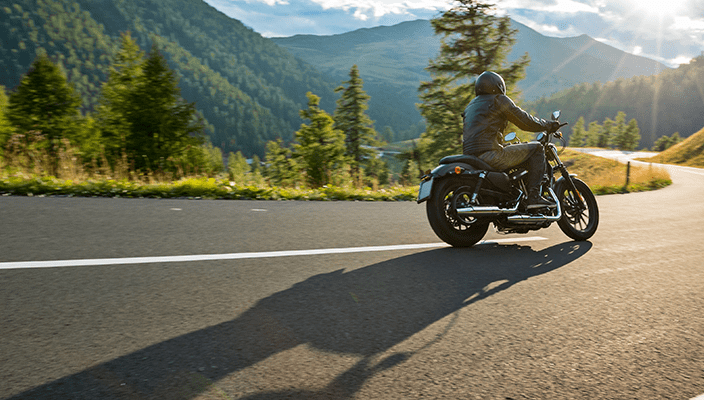 Motorcyle riding on asphalt road