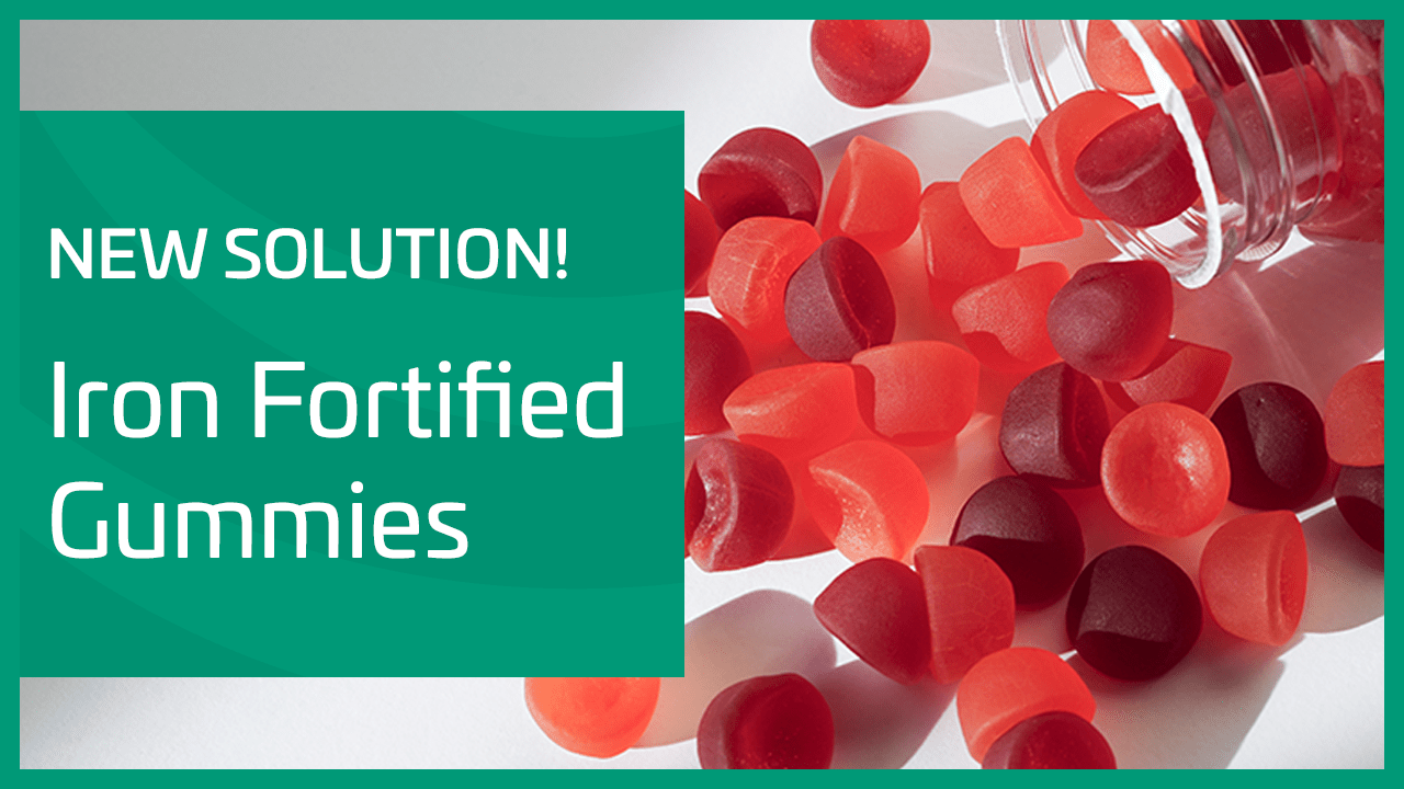 Promotional graphic announcing iron-fortified gummies, with red gummies spilling from a container.
