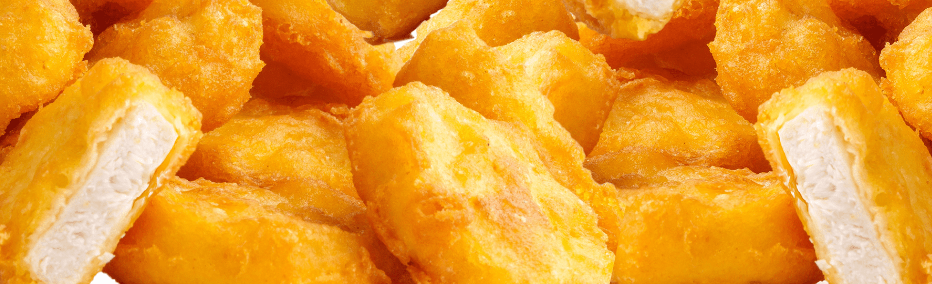 golden brown chicken nuggets piled together