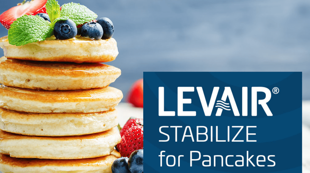 Stack of pancakes with berries and mint next to text 'LEVAIR® STABILIZE for Pancakes'