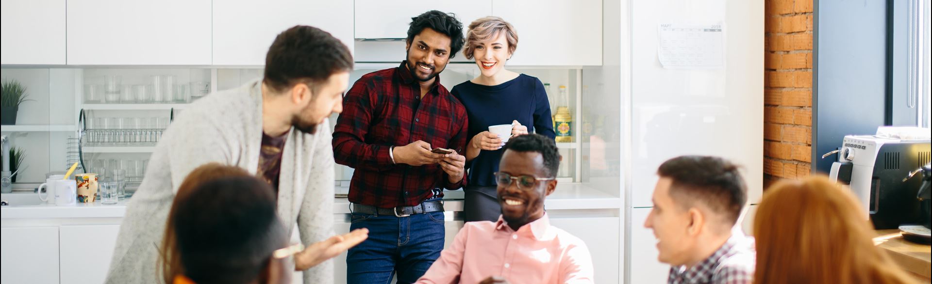Coworkers bonding in a break room