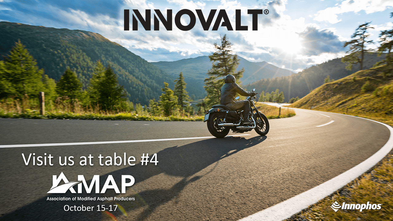 A biker riding a motorcycle on a scenic roadway