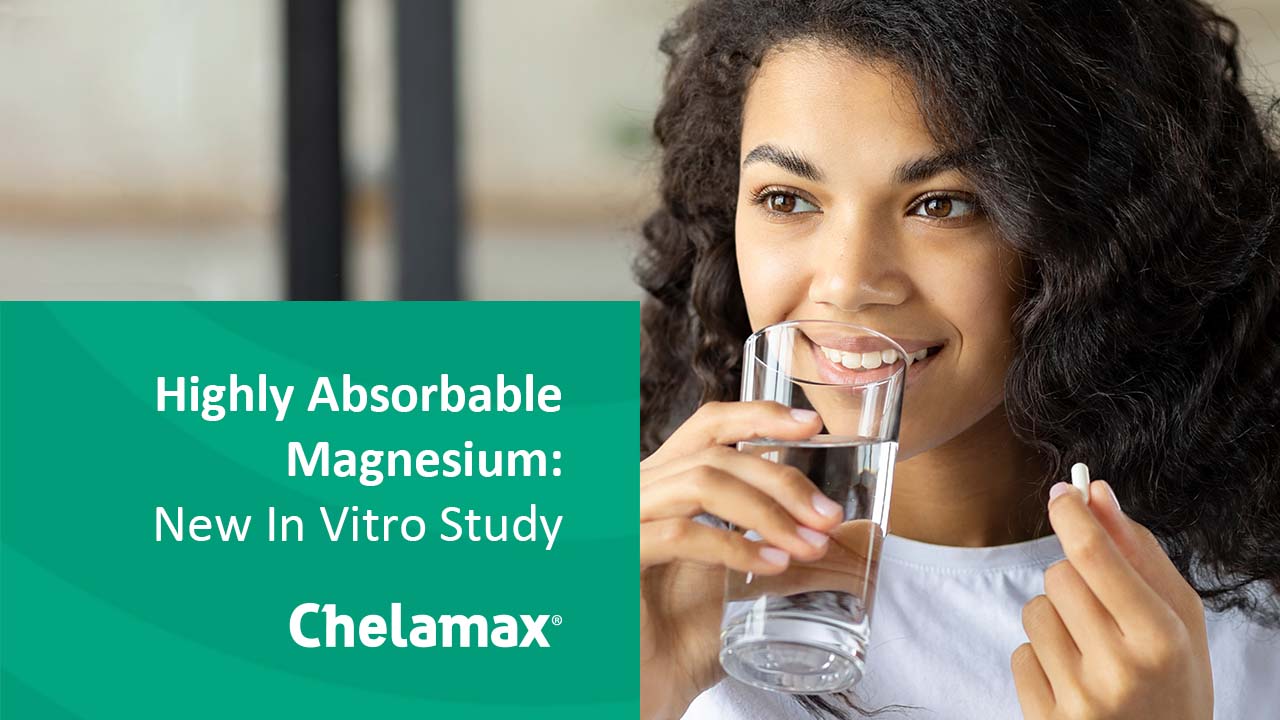 A woman drinking water holding a pill