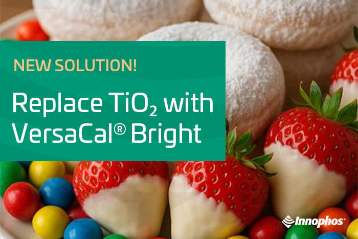 Advertisement with strawberries in white chocolate, colorful candies, and pastries; text promotes VersaCal® Bright as a TiO₂ replacement.