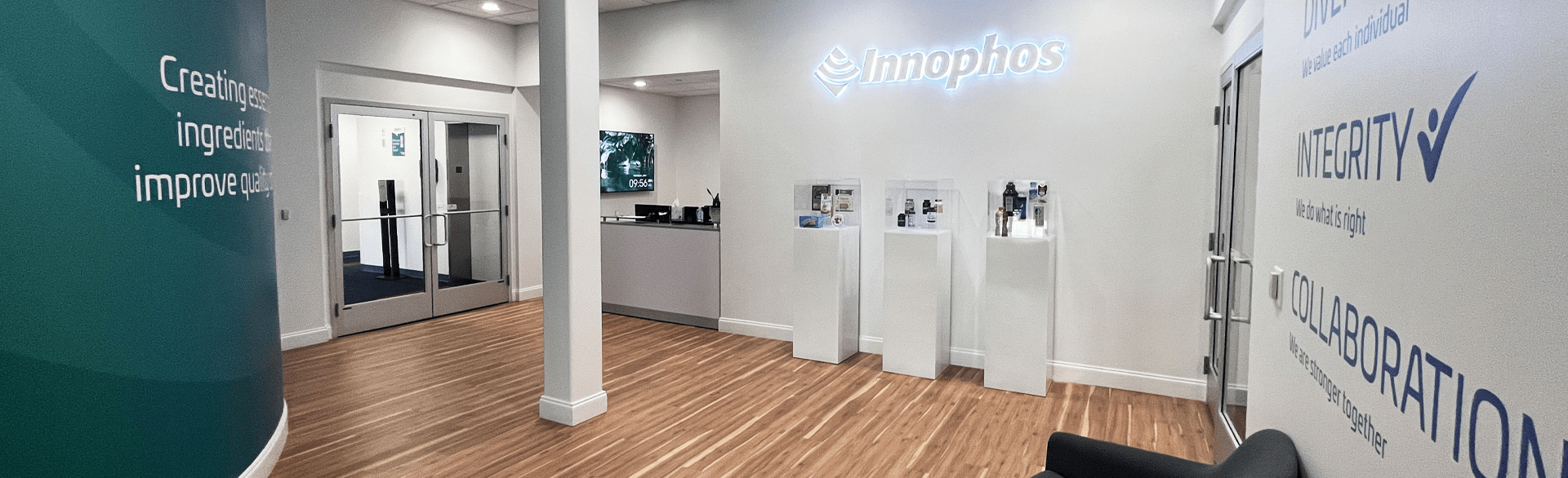 Modern office interior with Innophos branding and motivational text on the walls.