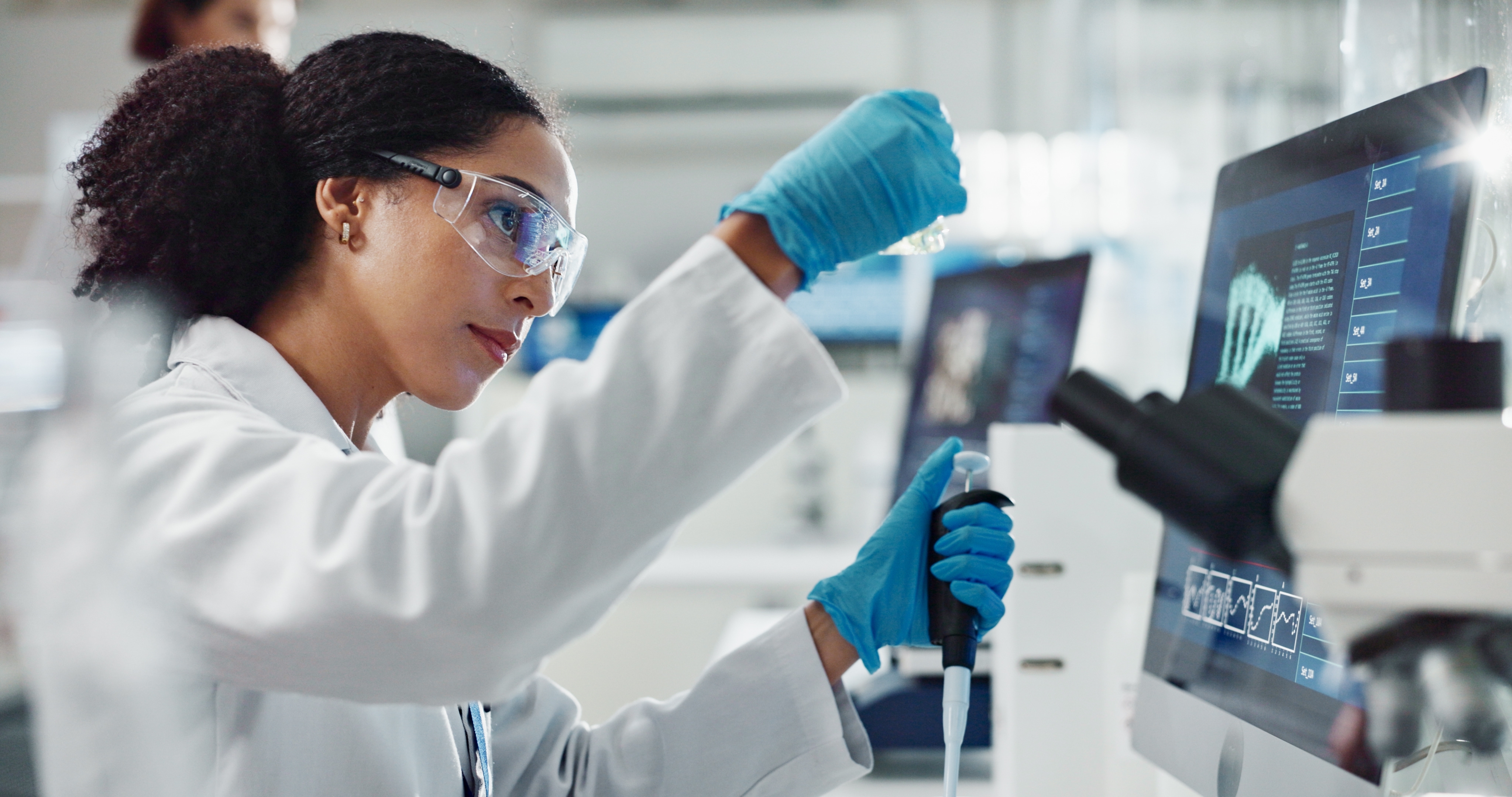 Scientist using a pipette in a laboratory